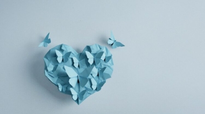 Heart with origami butter flies in detailed origami paper, sky blue color, realistic, 3d rendering, transformation, isolated, crumpled paper origami, origami butterfly